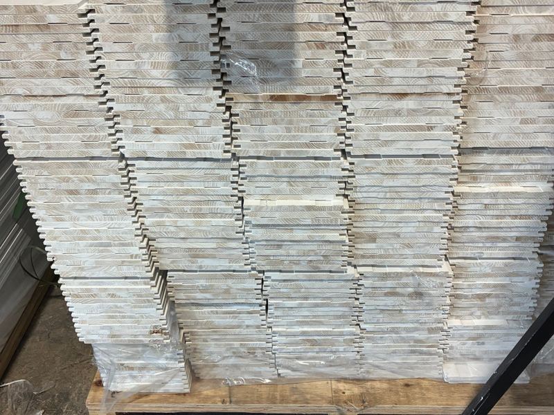 Ends of primed shiplap boards showing the lap joint